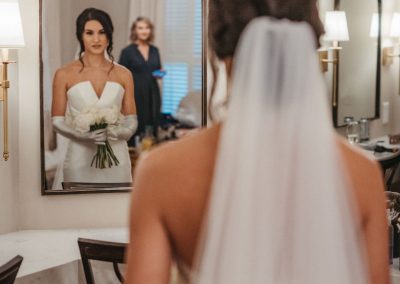 bride gazing in the mirror