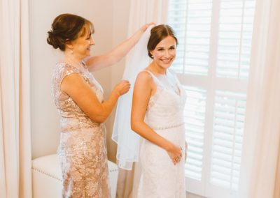 bride getting ready for her wedding day with her mother