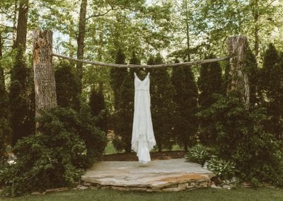 wedding dress on arch outdoors
