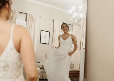 happy bride looking in the mirror