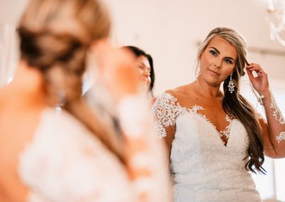 bride smiling in the mirror
